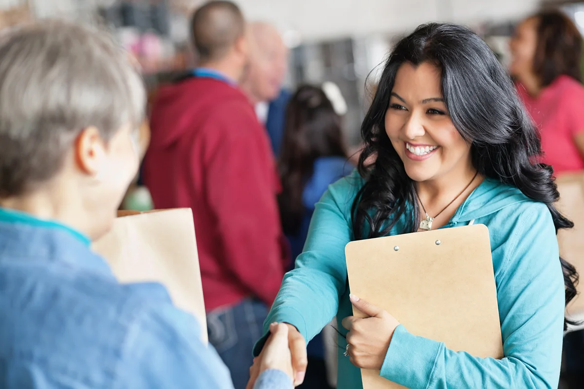 smiling woman handshake